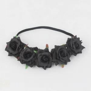Detailed view of the black rose floral headband, showing fabric flowers and elastic band.