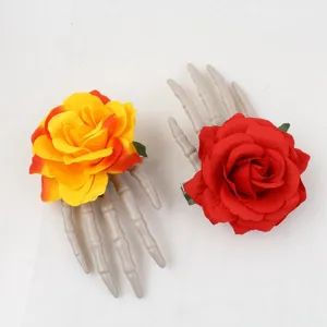 Skeleton hand hair clip detail shot, featuring red and yellow roses for Halloween party.