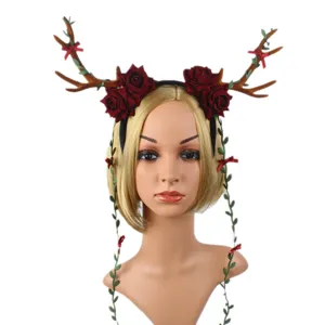 Christmas deer antler headband with dark red roses and hanging vines for holiday party.