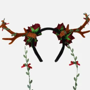 Close-up detail of Christmas reindeer antler headband with red roses and hanging vine decorations for party wear