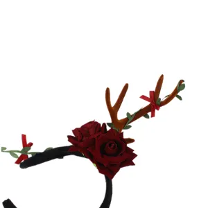 Christmas reindeer antler headband with dark red roses and green leaves for holiday party.