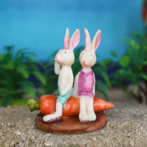 Miniature white rabbit and carrot figurine for succulent plant setup and sand tray decor.