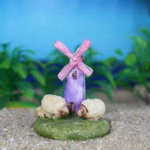 Miniature resin windmill and sheep ornament detail showing delicate craft for sandbox design.