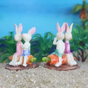 Resin white rabbit carrot miniature figurines for succulent landscaping and sand tray decor details.
