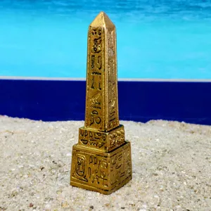 Egyptian obelisk miniature detail view, ancient hieroglyph carved golden stone decor sand tray toy