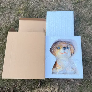 Detail view of the cute sitting dog resin figurine for home and garden decoration.