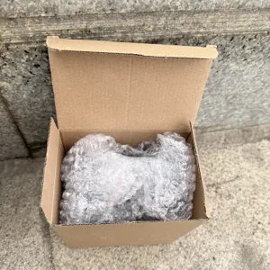 Packaging box with bubble wrap protection showing product delivery detail securely.