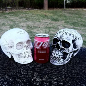 Resin skull ornament featuring anatomical and astrological designs for Halloween party decor.