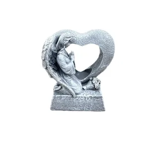 Resin praying angel statue detail showing stone texture and hollow heart arch design for memorial