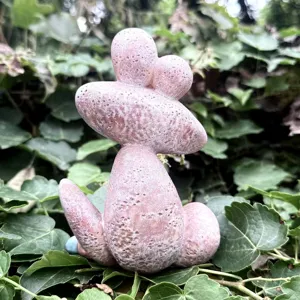 Resin funny frog figurine detail, unique pink garden ornament for outdoor patio and indoor decor.