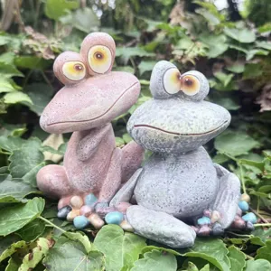 Funny resin frog figurine garden ornament for outdoor indoor yard decoration setup detail.