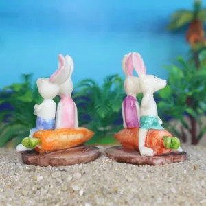 Miniature white rabbit and carrot resin figurines for succulent micro landscaping and sand tray decor.