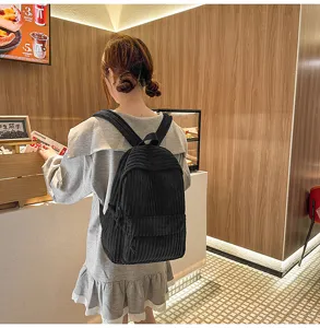 Casual black corduroy backpack for women, stylish everyday school bag and large capacity daypack.