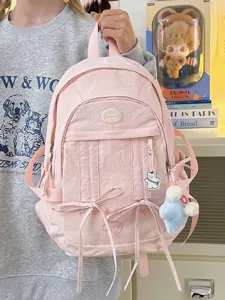 Pink casual backpack for women, large capacity school bag, fashionable travel daypack with cute bow.