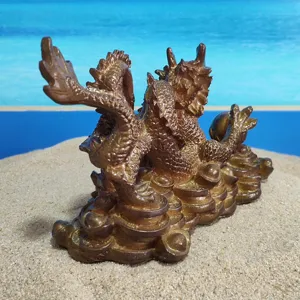 Detailed close-up of a Chinese dragon figurine with golden ingots, traditional feng shui decor.