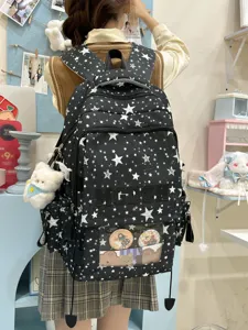 Sac à dos étudiant noir imprimé d'étoiles avec poche transparente et pendentif ours.