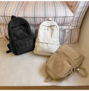 Corduroy backpack detail shot showing texture, multi-color options, and casual style design.