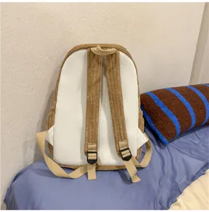 Detailed view of the casual corduroy backpack showing adjustable shoulder straps and design.