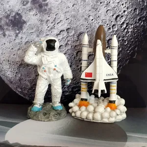 Space shuttle and astronaut figurine set, perfect desktop decoration for kids and space fans.
