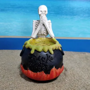 Halloween resin skeleton cauldron ornament, spooky tabletop decoration for holiday party props and decor.