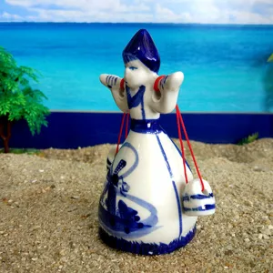 Blue and white porcelain figurine of Xishi carrying water, traditional Chinese sandplay therapy toy.