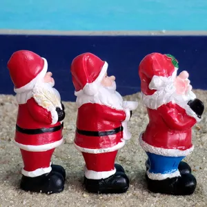 Resin Santa Claus figurines detail shot, mini holiday ornaments for sand tray decor.
