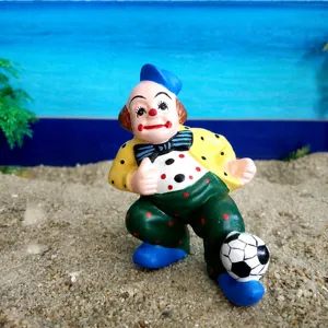 Clown figurine detail view, resin sand tray toy, miniature soccer player decoration.