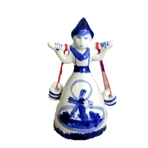 Blue and white ceramic figurine desktop ornament, traditional style carrying water design for home decor.