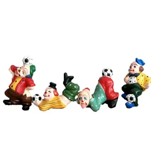 Set of 4 colorful resin clown figurines playing with soccer balls, ideal for sand tray toys.