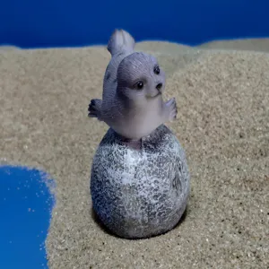 Resin seal figurine detail shot, cute animal desktop decoration, miniature sand table ornament.