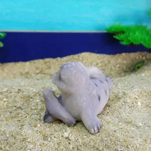 Resin seal figurine detail shot, cute ocean animal sand table toy ornament for home decor.