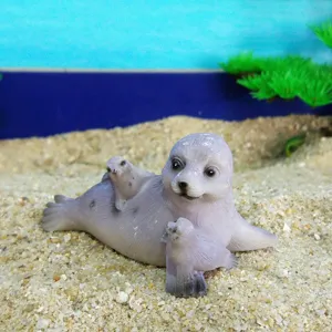 Detailed shot of resin seal family figurine for sandplay and home decor scenery.