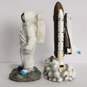 Astronaut and space shuttle rocket figurines, resin space theme toys for kids and desktop decor.