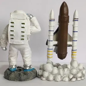 Astronaut and space shuttle figurine set, resin rocket launch model sandbox toy detail shot.