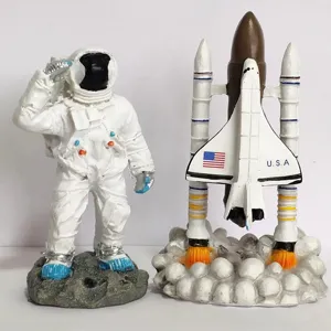 Space shuttle and astronaut figurine set, detailed desktop toy models for kids and collectors.