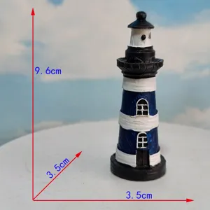 Detailed view of the Mediterranean style miniature lighthouse resin ornament with blue and white finish.