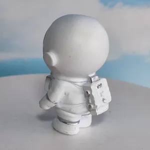 Astronaut figurine detail showing spacesuit and backpack design, perfect for room desktop decor.