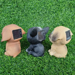 Details of solar dog lawn lights showing back solar panels on green grass for garden decor.