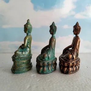 Miniature Buddha statue set, detailed sitting figurine, vintage bronze finish, fine craft detail.
