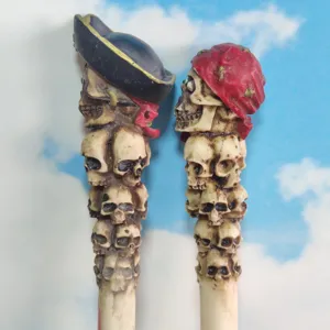 Detailed close-up of resin pirate skull hair sticks, perfect for spooky Halloween crafts.