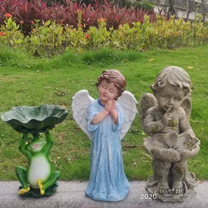 Detailed view of resin garden ornaments including frog bird feeder and angel statues.
