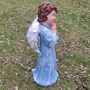 Outdoor garden angel statue resin ornament detail view showing prayer pose and wings.