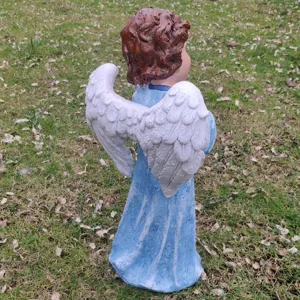 Resin angel garden statue with detailed white wings and blue dress for outdoor yard decor.