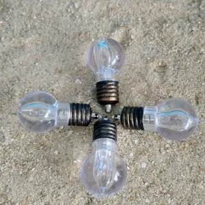Miniature transparent bulb decoration, detailed view of mini light pendant for creative use.