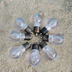 Miniature clear light bulb charms and decorative pendants set for party and event styling.