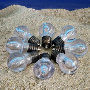 Decorative clear miniature light bulb shaped candles props for creative parties and events.