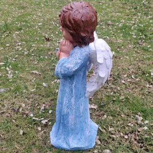 Resin angel garden statue detail showcasing blue robe and white wings for outdoor yard decor.