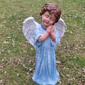 Detailed view of a lovely praying angel garden statue, outdoor decorative resin ornament.