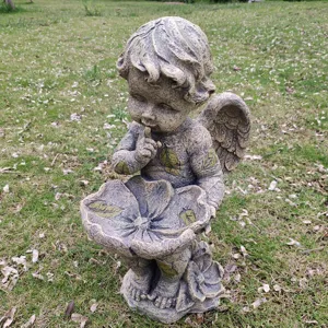 Charming garden angel statue with bird feeder bowl, vintage stone finish outdoor decor.
