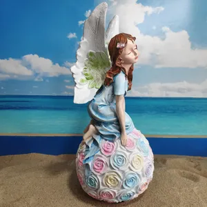 Resin angel flower fairy ornament, detailed sculpture for garden decoration, delicate roses ball.